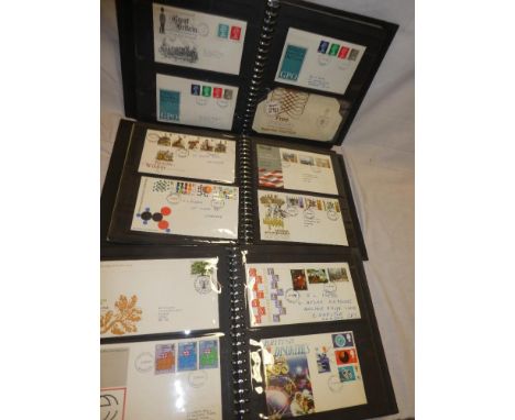 Three folder albums containing a collection of over 170 GB first day covers 1964-1984