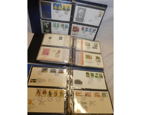 Three albums containing a large selection of GB first day covers 1970's-1990's