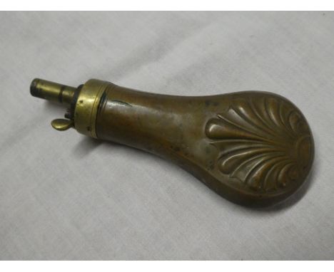 A 19th Century brass mounted copper pistol powder flask with raised acanthus decoration