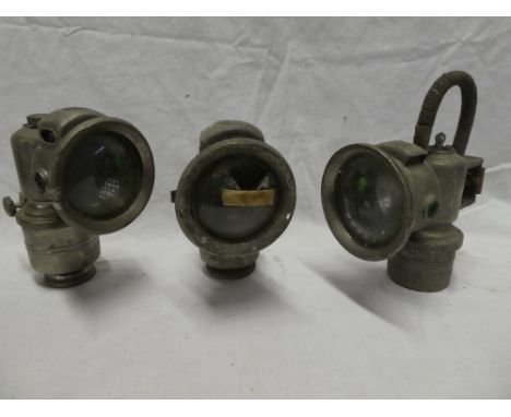 Three various carbide motorcycle lamps including P &amp; H Revenge lamp etc (af)
