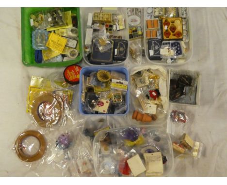 A box containing modern dolls house electric lighting kits, accessories in packets etc