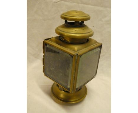 An old brass motoring oil lamp by Radmore of Birmingham 10 1/2" high (af)