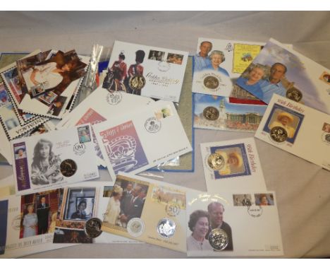 Two folder albums containing a selection of Royalty related covers including coin covers, booklets, first day covers, etc