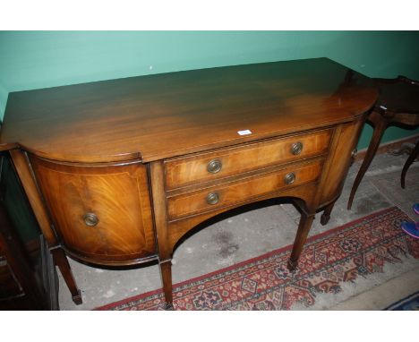 A reproduction finished Sideboard, Georgian in style with shaped top over central flight of two drawers flanked either side b