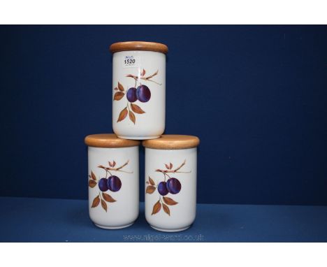 A set of three Royal Worcester kitchen storage Jars with wooden lids and a plum design