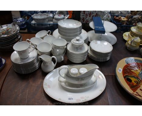 A Royal Doulton 'Twilight Rose' Tea and Dinner service in eleven dinner plates, meat dish, twelve cups and saucers, twelve si