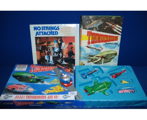 A 1992 boxed Thunderbirds Rescue Pack Watch, a 1966 Thunderbirds Annual and first pressing 1968 Thunderbirds 'No Strings atta