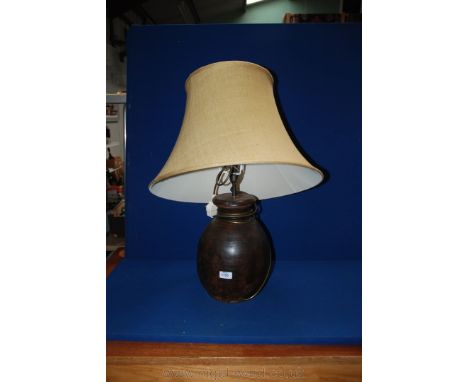 A barrel shaped rustic wooden Table Lamp with shade