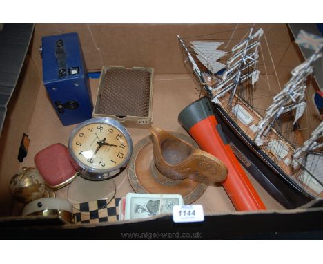 A quantity of miscellanea including a wooden model of Cutty Sark, Alarm Clocks, John Player Playing Cards, Blue Ensign No. E2