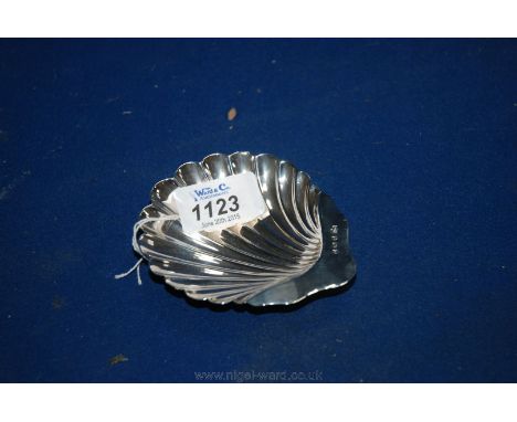A Silver shell shaped Trinket Dish with ball feet, with good clean marks for Birmingham 1913 made by William Locke
