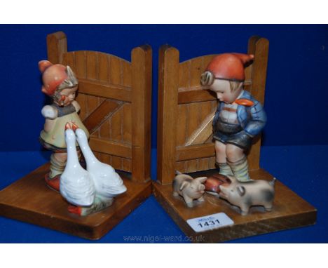 Two Goebel bookends - Boy with Pigs and Girl with Geese