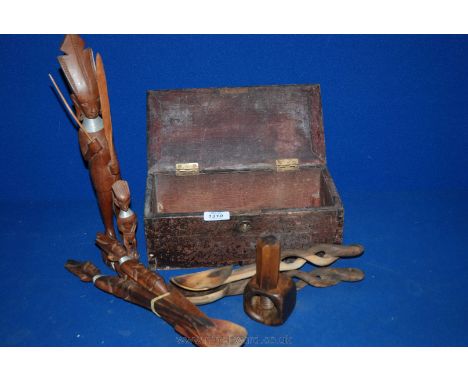 A vintage wooden box with brass hinges and handles together with a carved African fork, knife and spoon, hand carved salad se