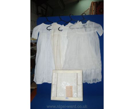 A vintage Rayon Goods serviette set, boxed and three vintage Christening Gowns