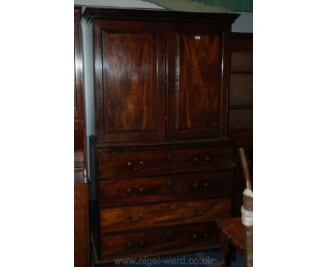 A superb late 18th/early 19th c. Mahogany Cupboard on Secretaire Chest having moulded cornice over the opposing pair of singl