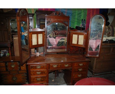 A very good and unusual Victorian Mahogany kneehole Dressing Chest having central arch top bevel plated mirror in swan pedime