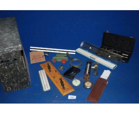 A quantity of slide rules, drawing instruments, shoe horn, stop watch, Meccano steam roller, etc.
