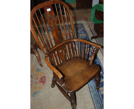 A 19th c. Ash Windsor Chair, hoop back with stacking fret-cut and pierced splats and stick supports running through the slend