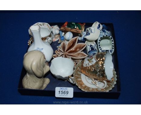 A quantity of miniature figures, Sylvac Dog, Wade leaf dishes, Royal Worcester bud vase, cabinet cups and saucers, etc.