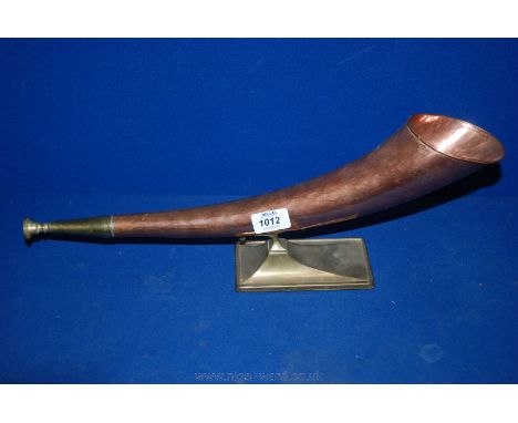 A Copper Hunting Horn mounted on a brass base