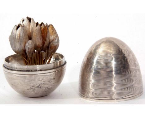 Elizabeth II silver "Surprise" egg, the wavy engine turned exterior with lift off cover containing a removable posy of autumn