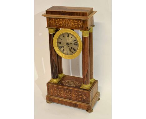 Mantel clock in neo-classical style, the dial supported by four classical columns, the frame with marquetry decoration, 50cm 