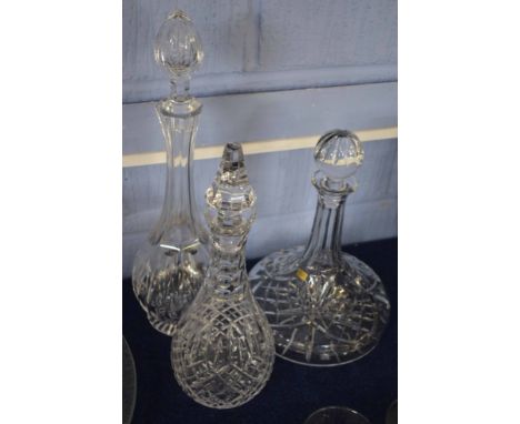Three heavy cut glass decanters, one ship's decanter and two further baluster decanters with stoppers (3)  