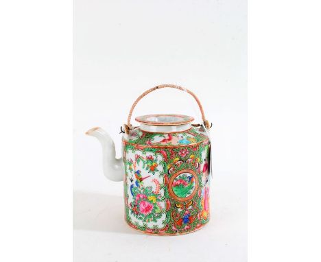 Chinese Canton teapot, early 20th century, polychrome painted with panels of figures amongst foliage and insects, with swing 
