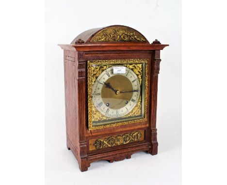 Early 20th Century oak bracket clock, Camerer Kuss &amp; Co New Oxford St, the arched top with gilt metal swag pediment above