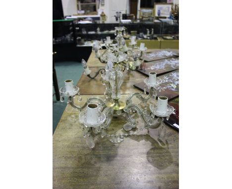 Pair of 20th century glass and brass chandeliers, each with five branches and hung with prism glass drops, each 55cm diameter