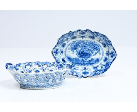 A Dutch Delft blue and white reticulated bread basket on stand with tea tree design, 18th C.27 x 20 cm  The base marked 'VDui