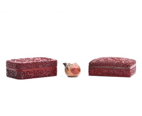 Two Chinese red lacquer boxes and covers and a pottery water dropper, 20th C.H 6 - L 14,5 - D 10,5 cm H 5,5 - L 16 - D 10,5 c