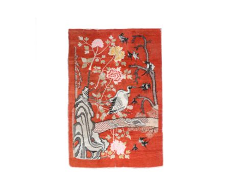 A Chinese or Mongolian Samarkand carpet with birds among blossoming branches, early 20th C.231 x 139,5 cm