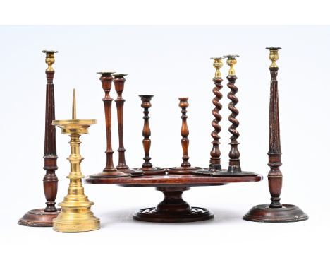 Four pairs of English mahogany candlesticks, a tray on stand and a bronze candlestick, 19th/20th C.H 52,5 cm (the largest ite