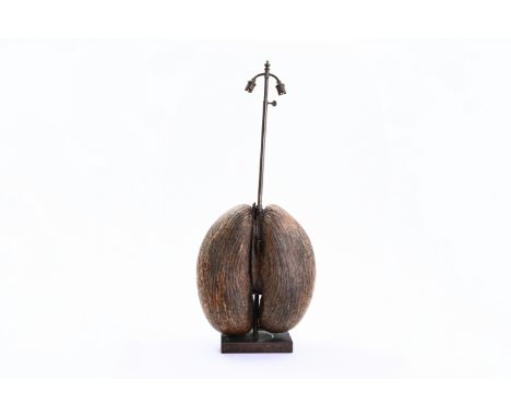A sea coconut or coco de mer (lodicea maldivica) mounted as lamp, Seychelles, 20th C.H 79 cm (incl. the mounts) 38 x 34 cm (t