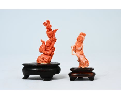Two Chinese carved red coral sculptures of a lady and playing children, 19th/20th C.H 14 - 11 cm (with bases)