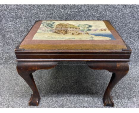 Antique mahogany tapestry footstool with claw and ball feet