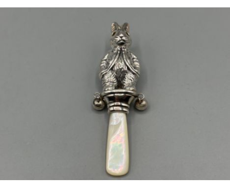 Sterling silver Peter rabbit babies rattle with mother of Pearl handle