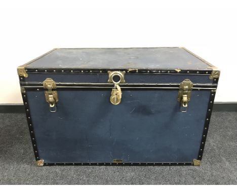 A large metal bound travelling trunk