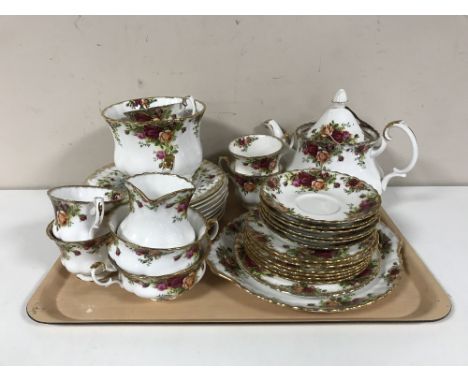 A tray containing a twenty-two piece Royal Albert Old Country Roses tea service together with eight Royal Albert Britain's Wi