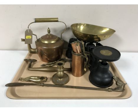 A tray containing vintage kitchen scales with weights, antique copper and brass kettle, copper measures, nutcrackers, brass s