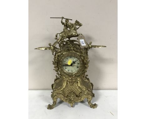 An ornate gilt metal French style mantel clock 