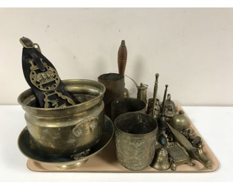 A tray containing a large quantity of assorted brassware including shell casing, hand bells, horse brasses, miniature miner's