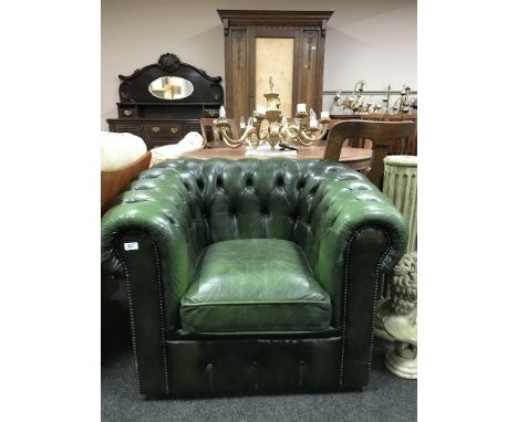 A green button leather Chesterfield armchair 
