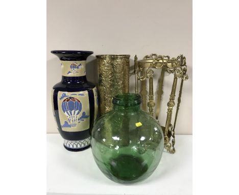 An ornate metal stickstand and a brass stickstand, three walking stick, one with silver mounts, a large blue glaze vase and a