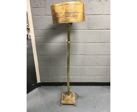 A heavy brass Corinthian column standard lamp with shade 