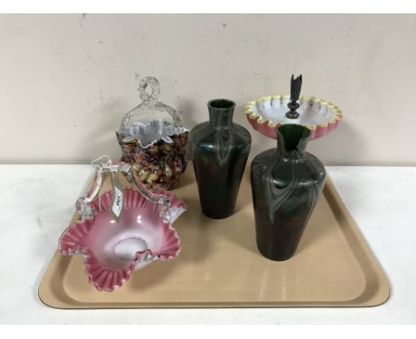 An early 20th century plated and pink glass epergne, two glass baskets and green glass vases 