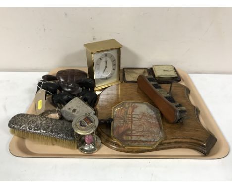 A tray of animal ornaments, cigarette box, napkin rings, desk clock, carriage clock, hand brushes etc 