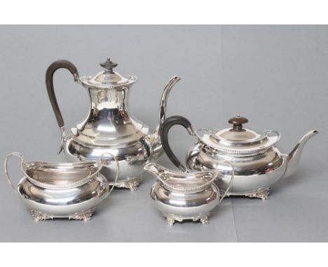 AN EDWARDIAN SILVER FOUR PIECE TEA AND COFFEE SERVICE, maker's mark HA, Sheffield 1901 (coffee pot) and 1902, of plain oval b