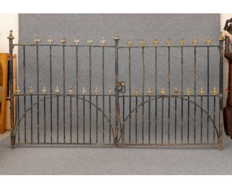 A PAIR OF WROUGHT IRON ENTRANCE GATES, early/mid 20th century, of multi barred form with fleur de lys finials, the end posts 