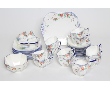 AN ART DECO SHELLEY CHINA QUEEN ANN TEA SERVICE printed and painted with the Lupin pattern, comprising twelve each cups, sauc